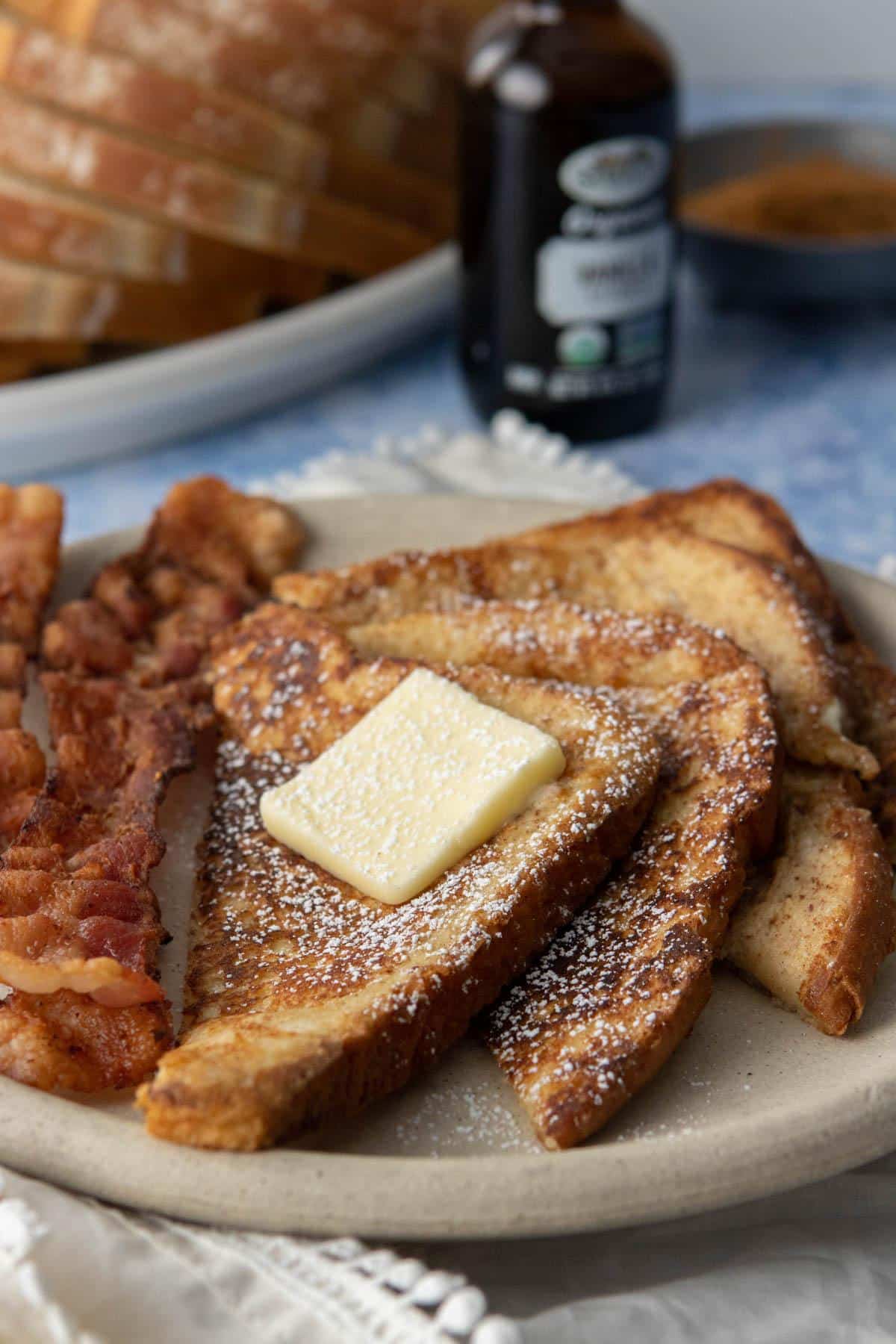slices of french toast with butter and powdered sugar on top