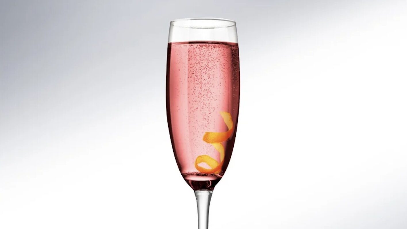 champagne flute with lillet and champagne with a lemon twist