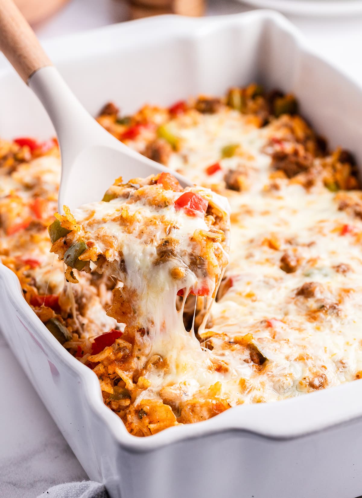 Stuffed pepper casserole with a spoon lifting some out of the dish.