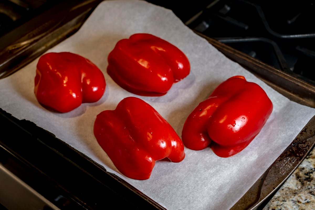 red bell pepper halves on sheet pan.