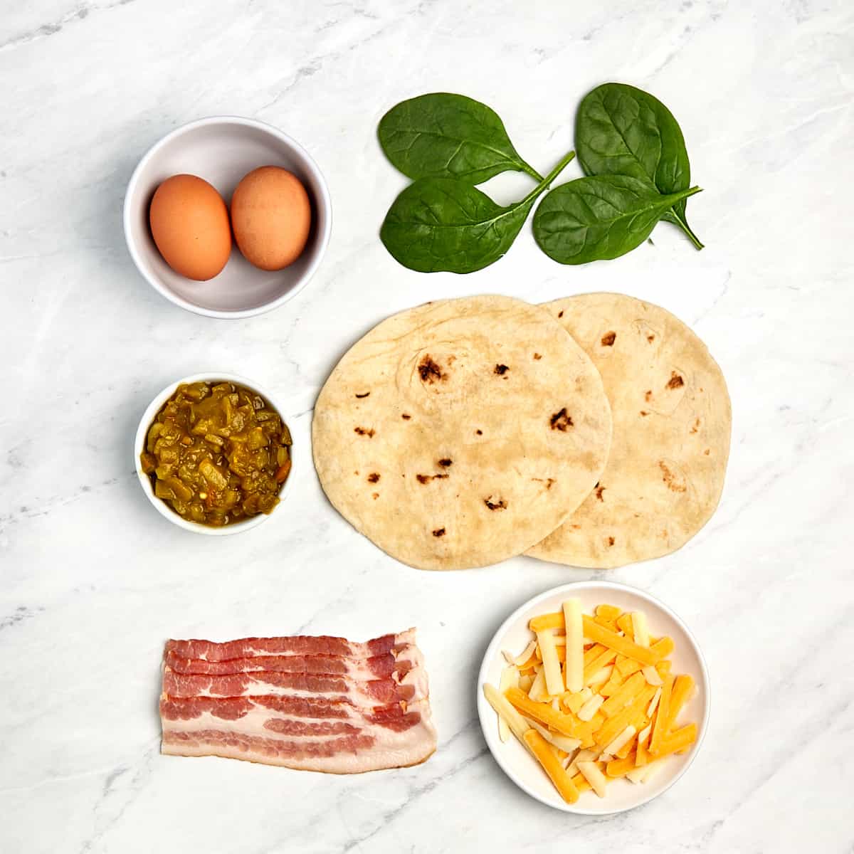 ingredients for breakfast quesadilla with bacon and spinach