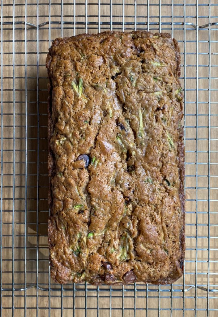 loaf of zucchini bread on cooling rack.