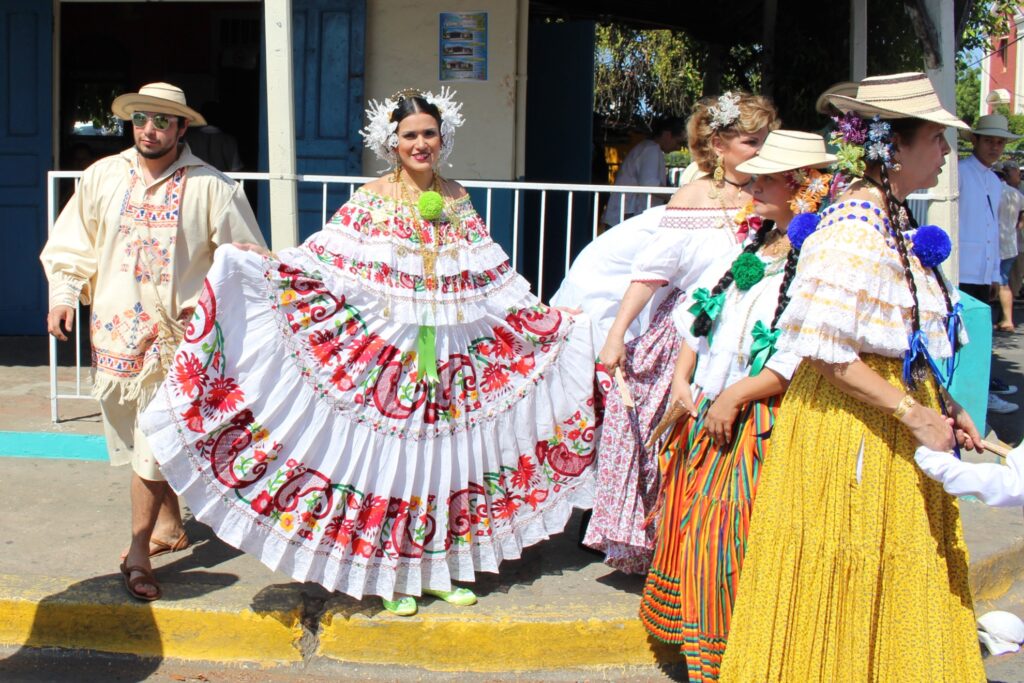 A woman in the Polleras Parade showing off her skirt.