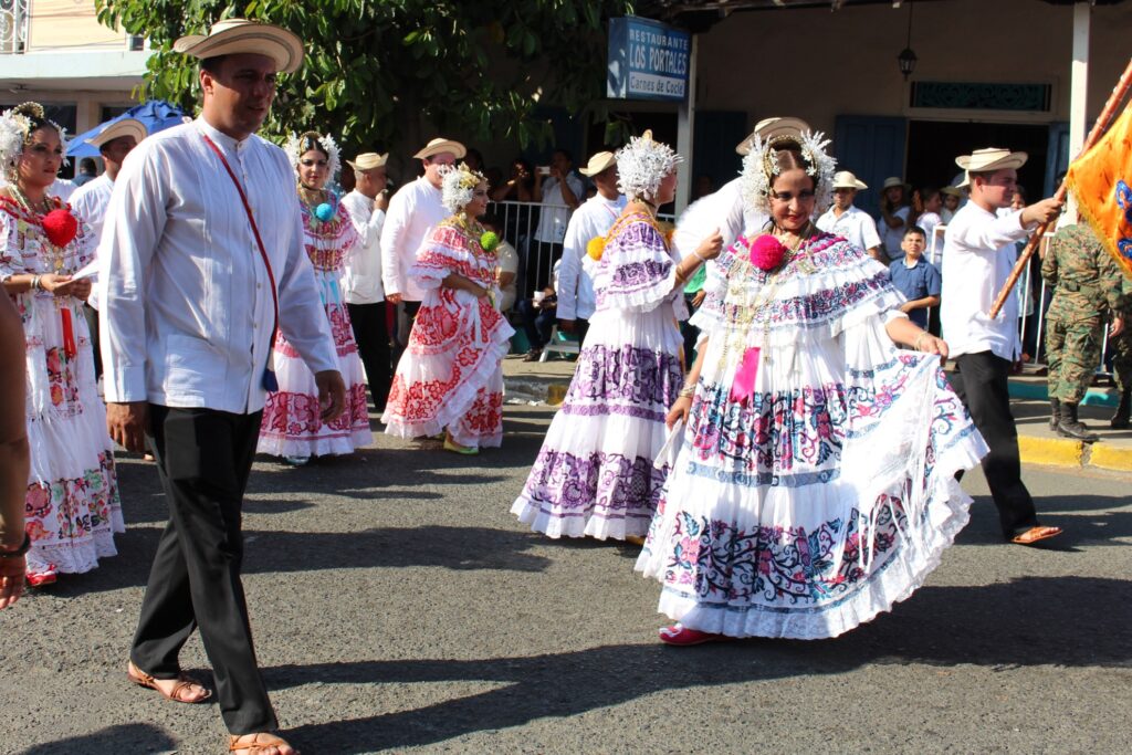 Men and women in traditional dress for the Polleras Parade.