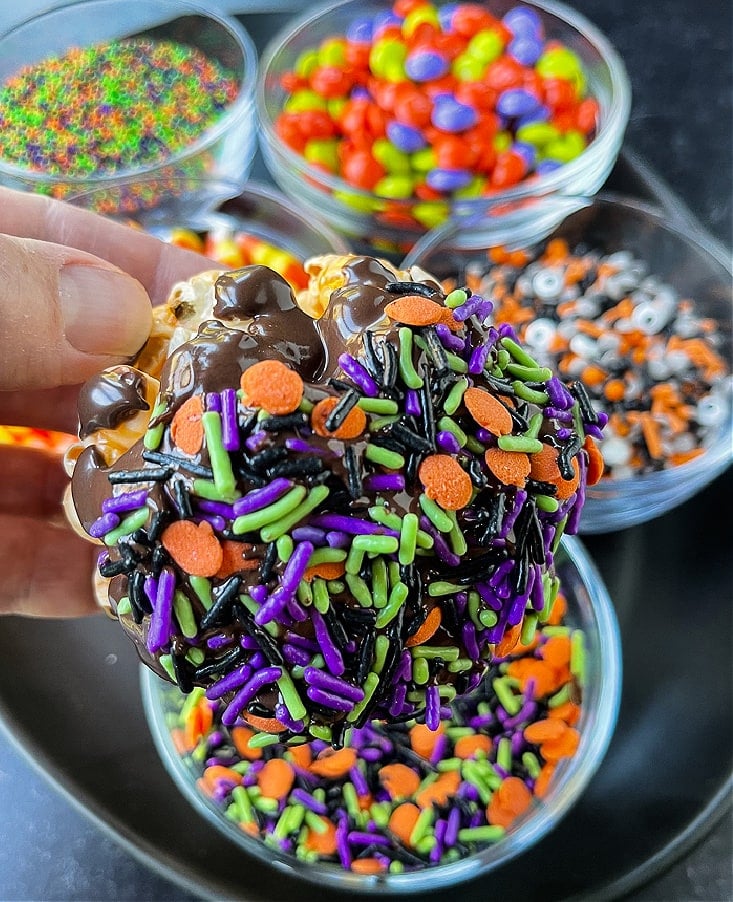 popcorn balls dipped in sprinkles for Halloween