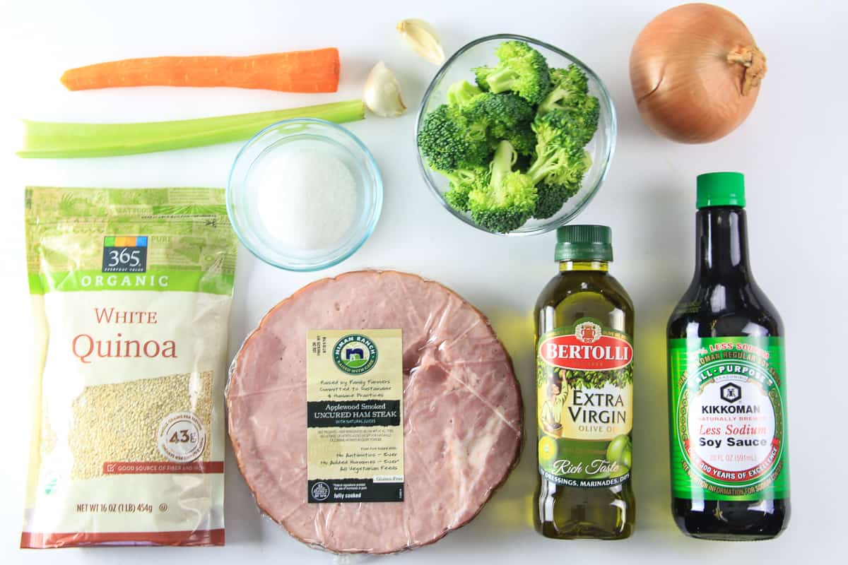 an overhead image of ingredients for quinoa fried rice on a white background