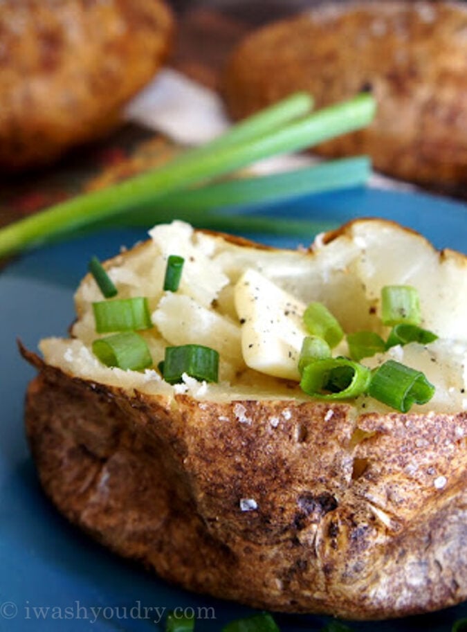 There are several methods to baking a potato, but this is the Perfect Baked Potato Recipe because the potato skin is crispy and the insides are soft and fluffy.