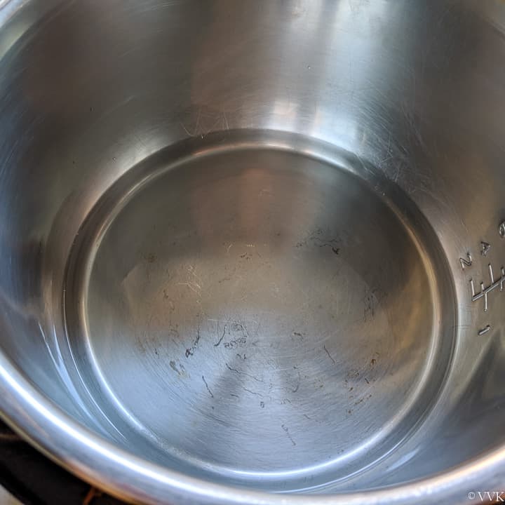 adding water to the inner pot