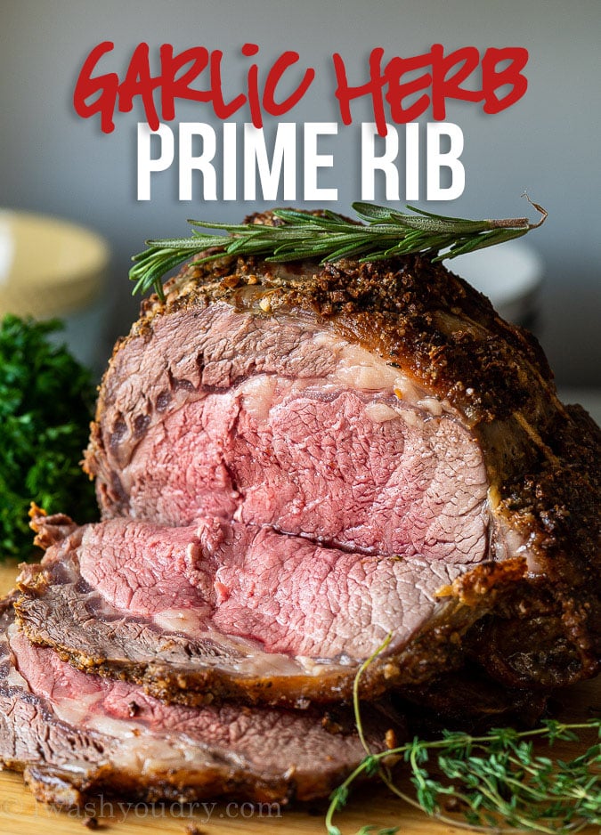 This is the BEST Garlic Herb Prime Rib Recipe! Seasoned with fresh garlic and herbs and roasted to perfection!