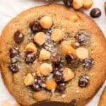 Pinterest pin showing three Butterscotch and Chocolate Chip cookies topped with flaky sea salt.