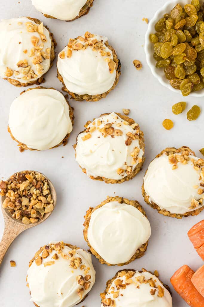 carrot cake oatmeal cookies topped with cream cheese frosting