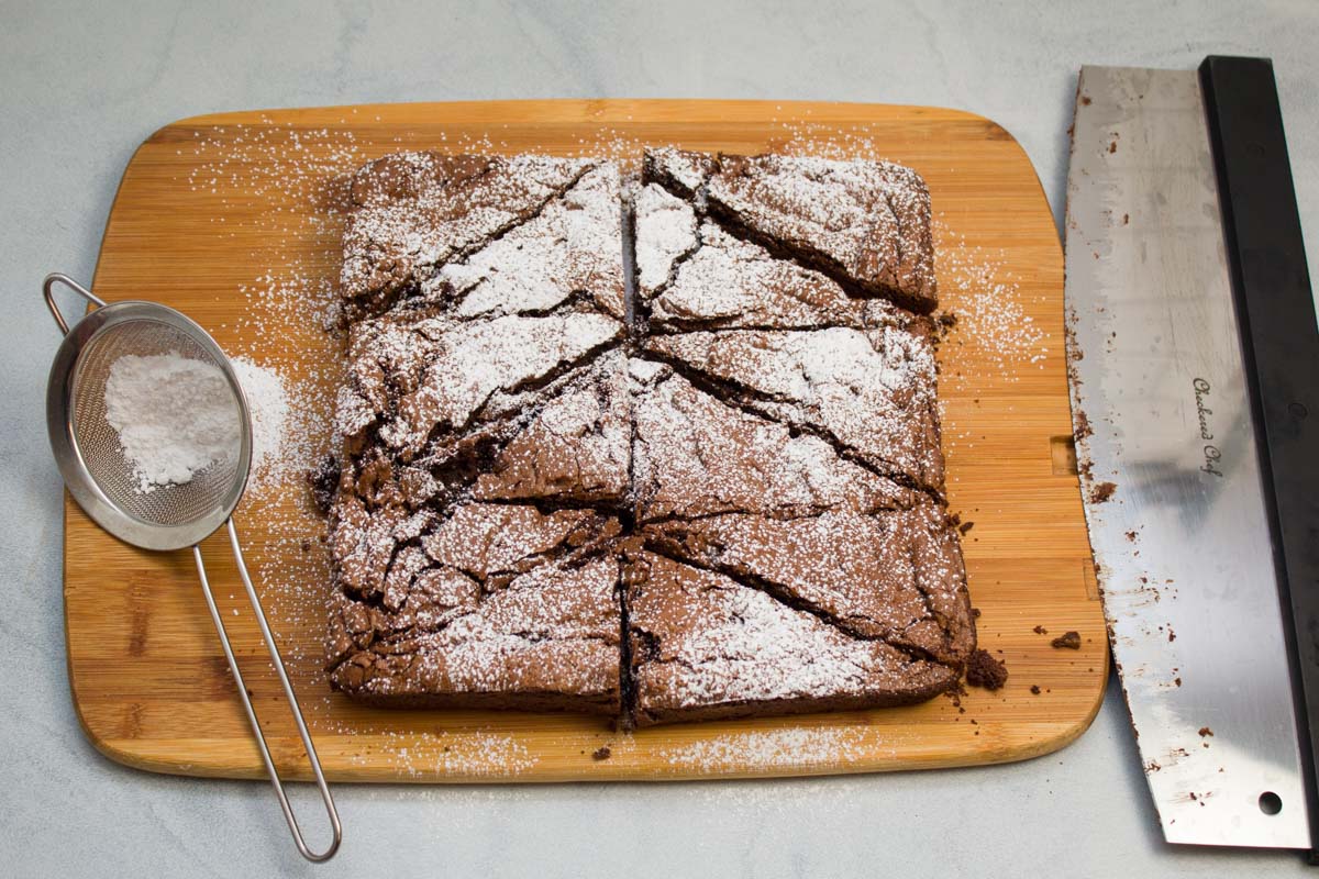 Espresso chocolate chip brownies dusted with powdered sugar.