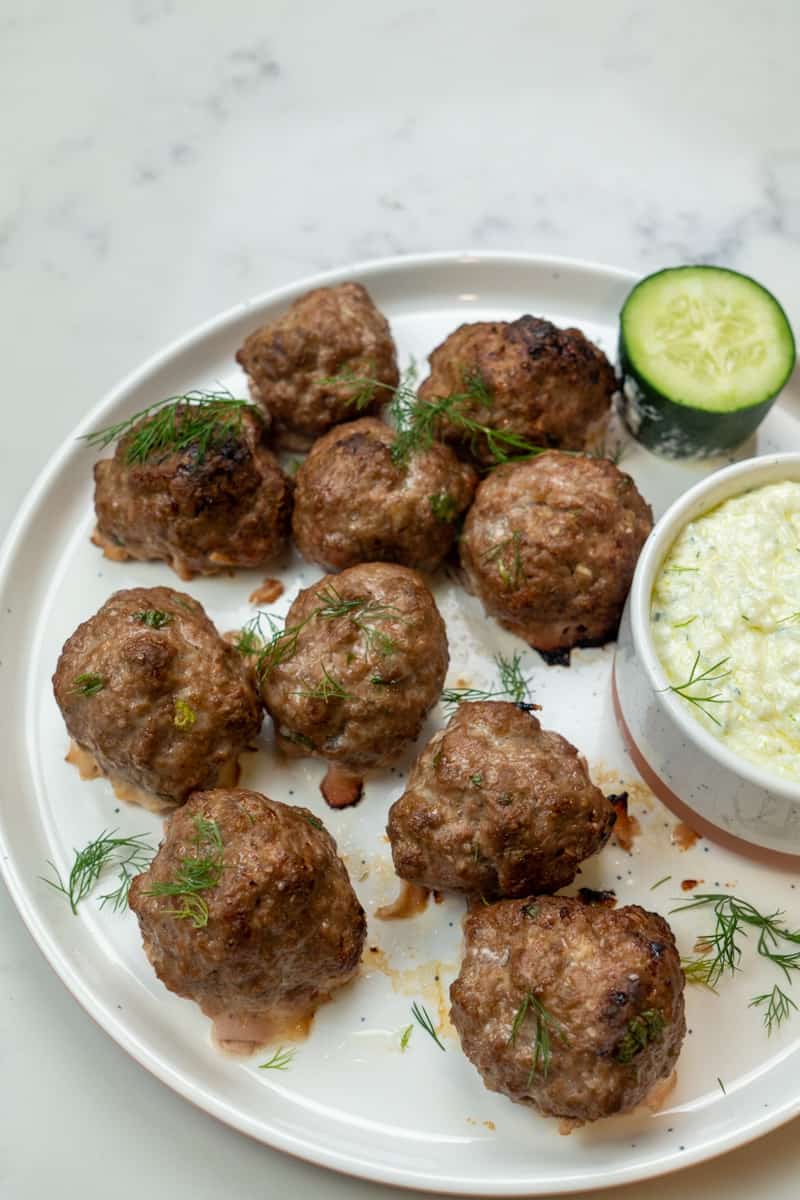Serve the meatballs: Transfer the meatballs to a serving platter and serve with the tzatziki sauce alongside. Enjoy these Oven Baked Lamb Meatballs with Tzatziki. 
