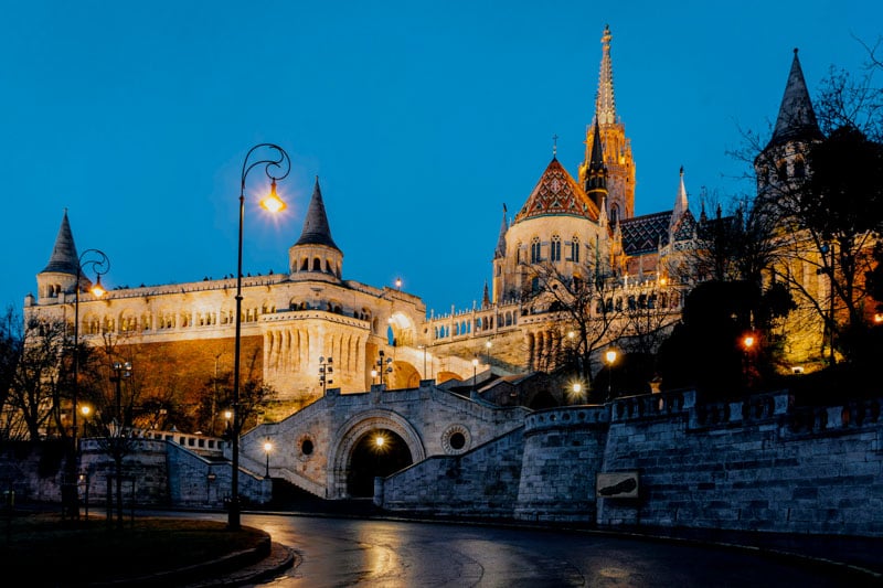 Experience the enchanting Fisherman's Bastion on Castle Hill at night, where the city sparkles like a storybook.