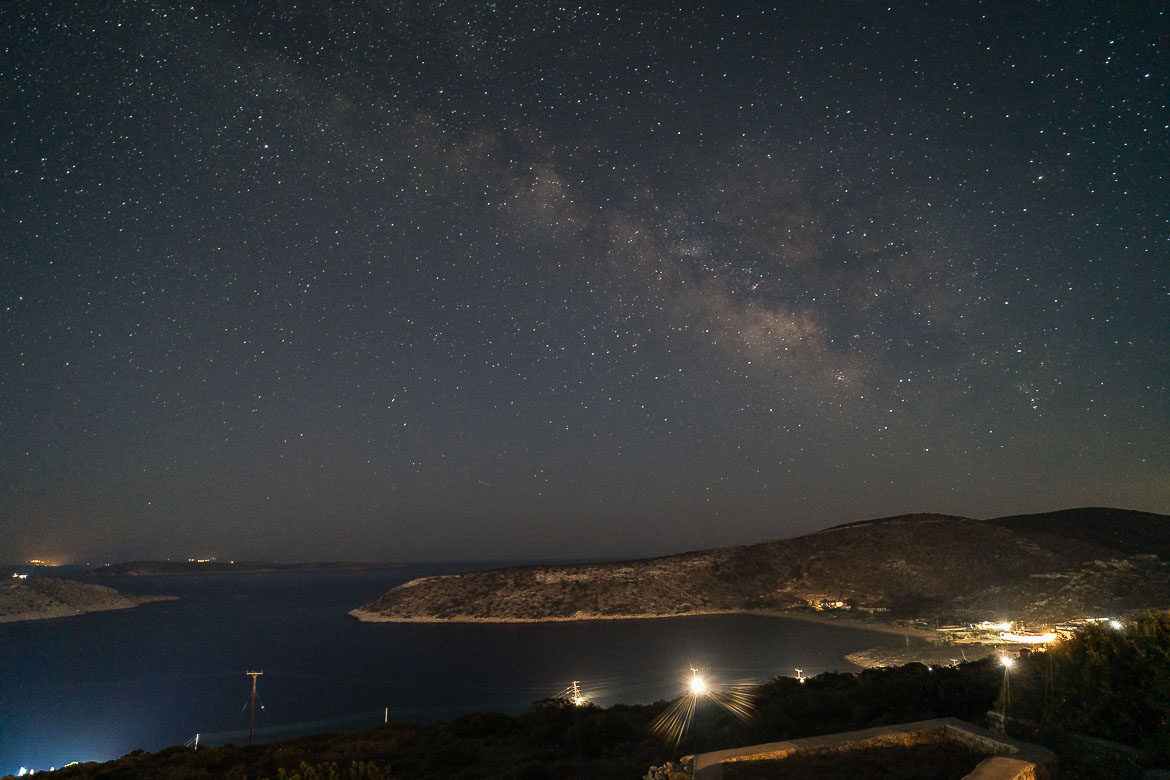 The milky way on a starry night and a panoramic view of Livadi bay.