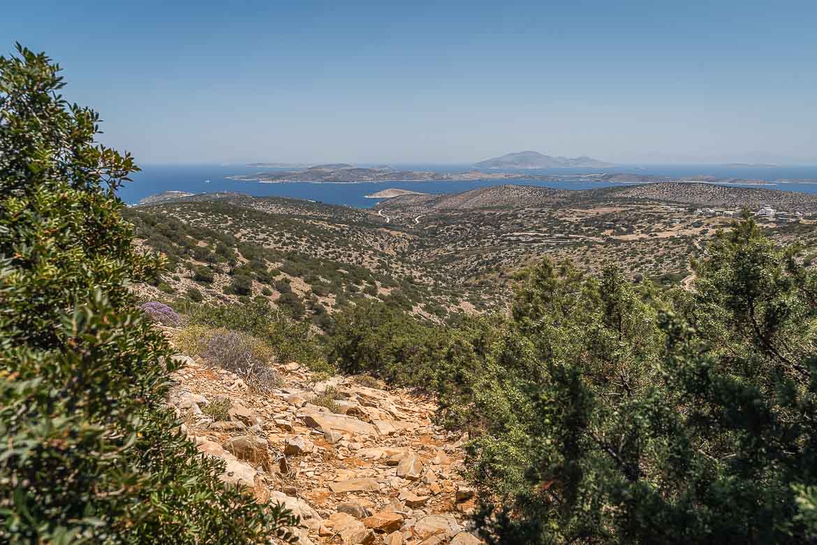 View of the steep slope along trail 3 with Schinoussa and Keros islands in the background.