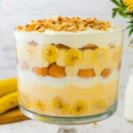 Banana pudding in a large bowl. Layered perfectly with bananas cream whipped topping and vanilla wafers.