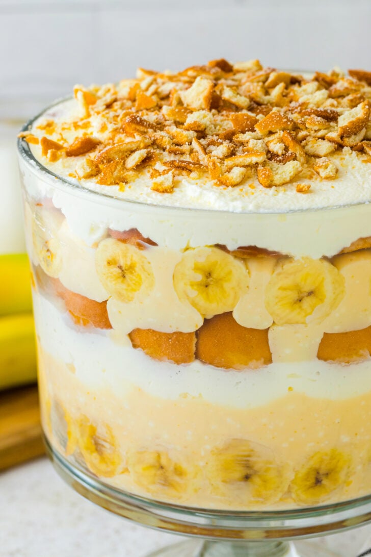 Banana pudding in a large bowl. Layered perfectly with bananas cream whipped topping and vanilla wafers.