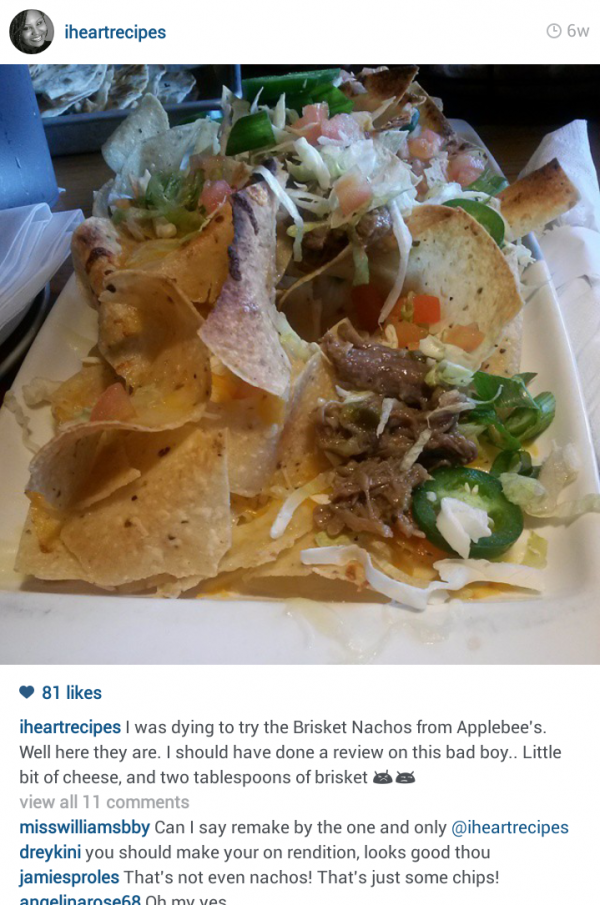 A screenshot of an Instagram post from I Heart Recipes with an image of restaurant nachos with barely any toppings, a caption, and comments from followers.