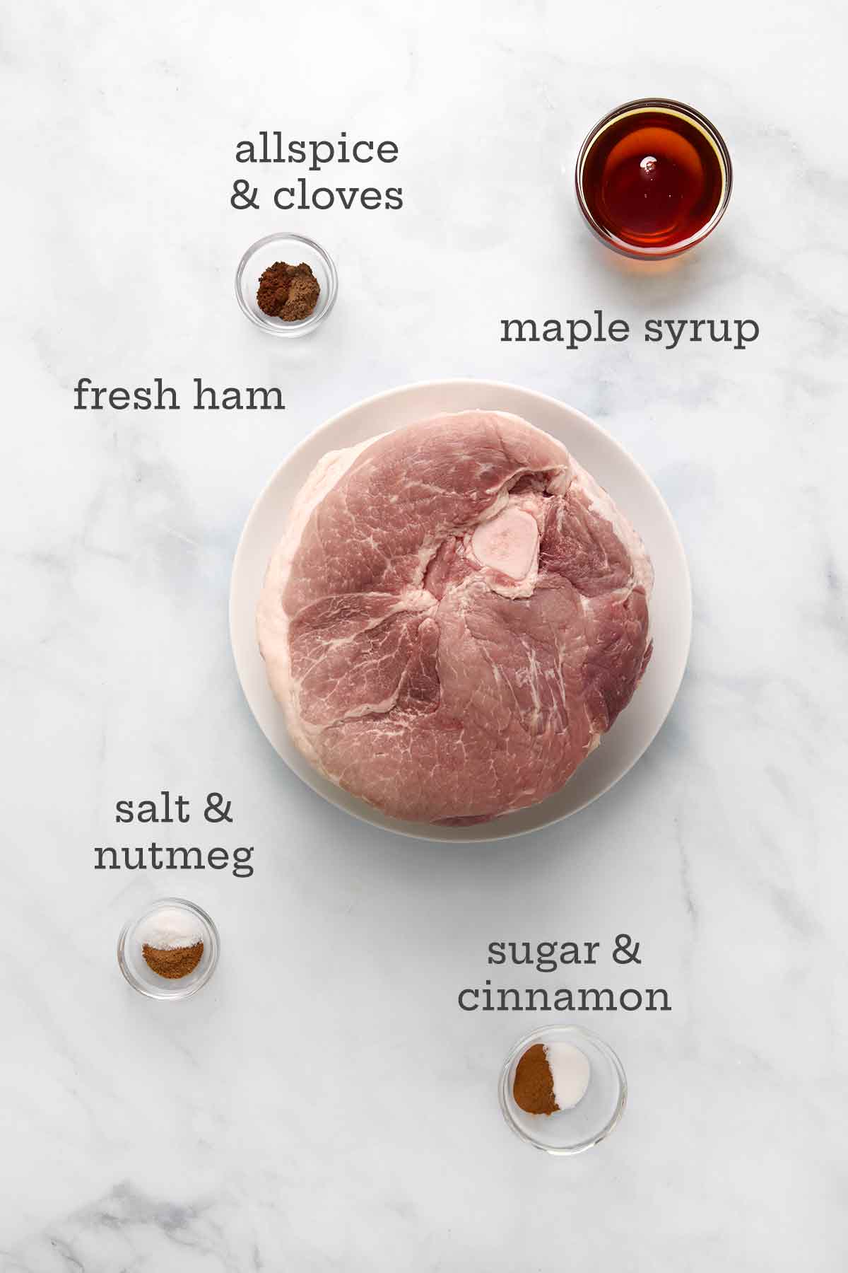 Ingredients for roasted fresh ham with maple-spice glaze--fresh ham, maple syrup, allspice, cloves, salt, nutmeg, sugar, and cinnamon.