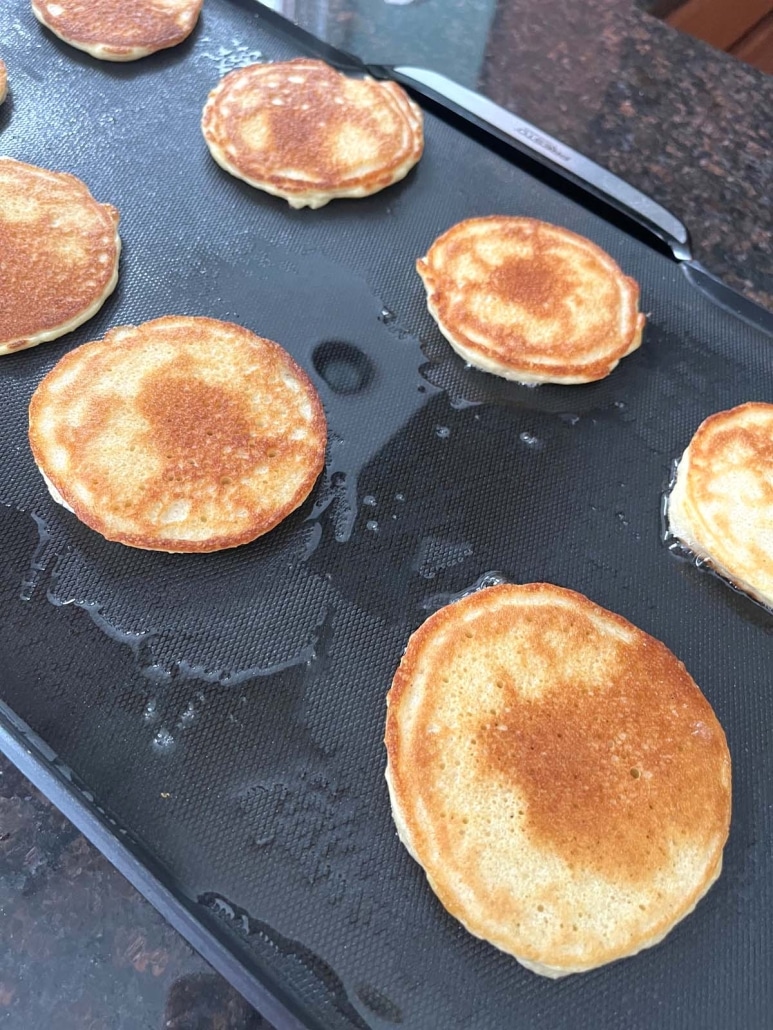 golden brown Cottage Cheese Pancakes on a hot griddle