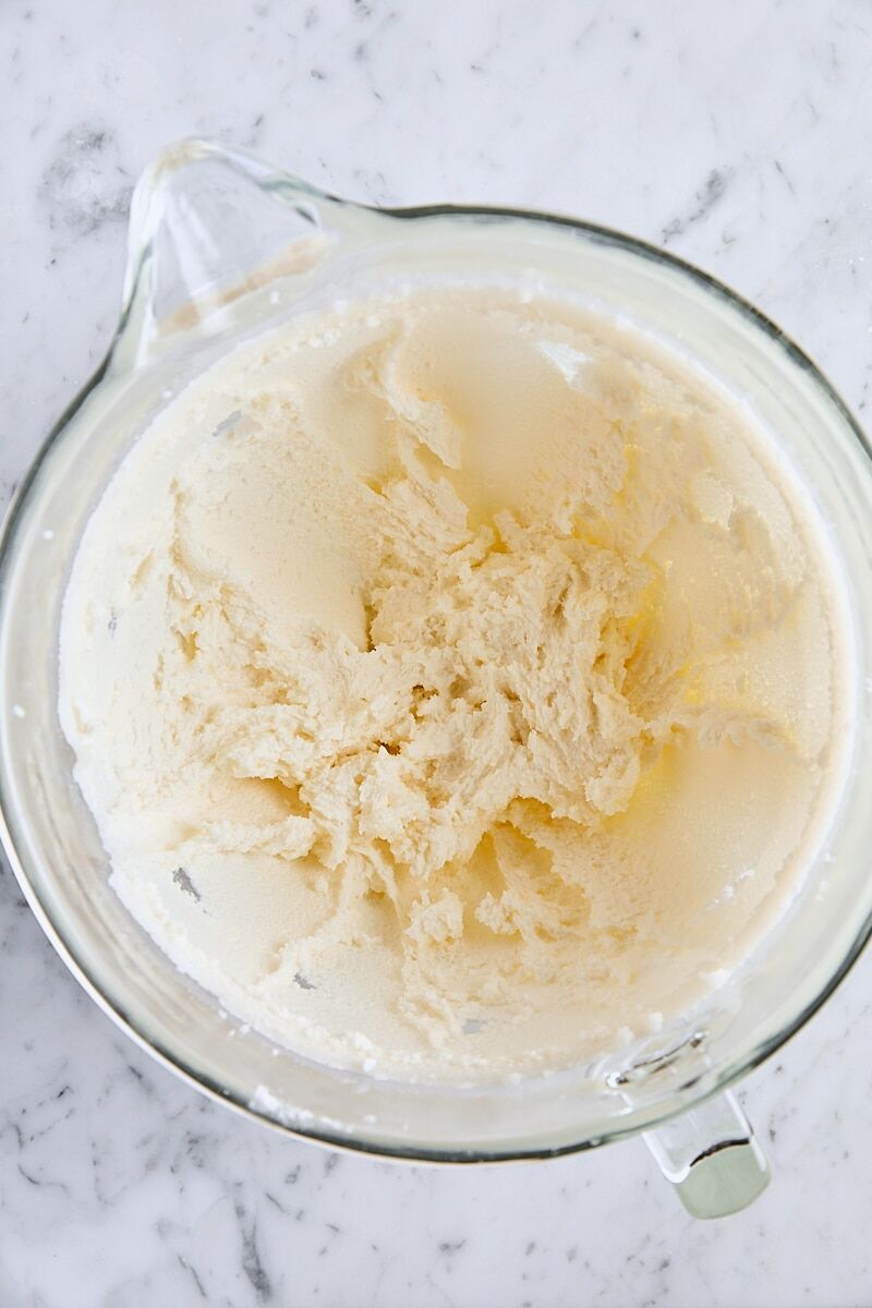 Butter and granulated sugar creamed together in glass mixer bowl
