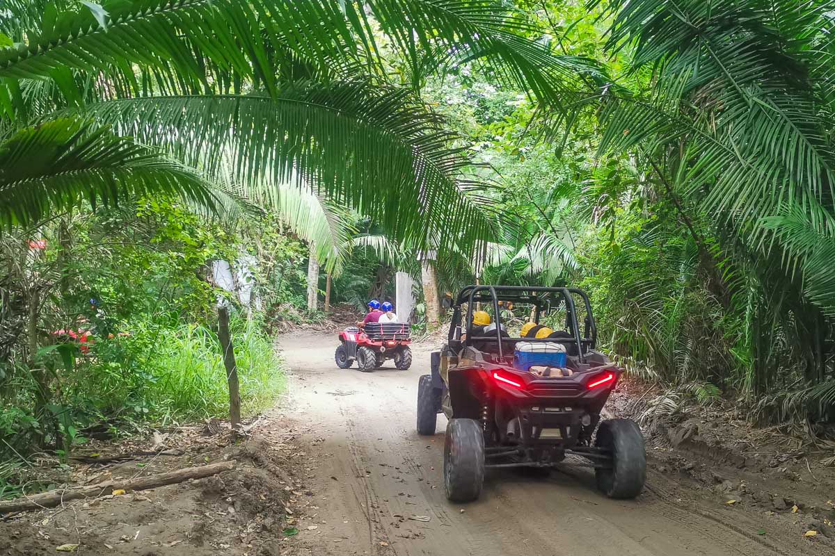 ATV buggy drives through the forrest in Playa del Carmen, Mexico
